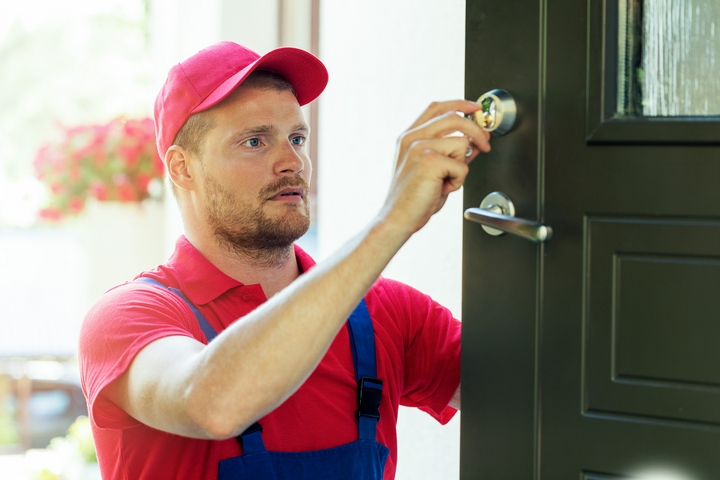 Locksmith-Service-Man-Repairing-House-Door-Lock